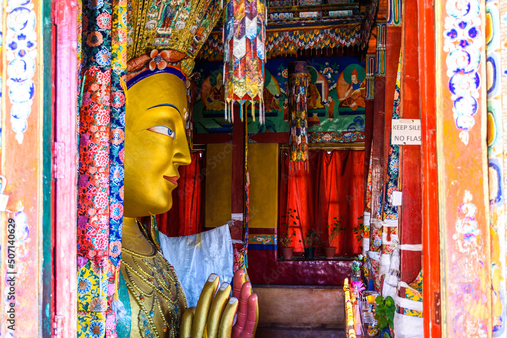 Fototapeta premium Beautiful and respectful golden buddha statue (Maitreya Buddha statue) in Thiksey monastery temple , Leh-Ladakh , India