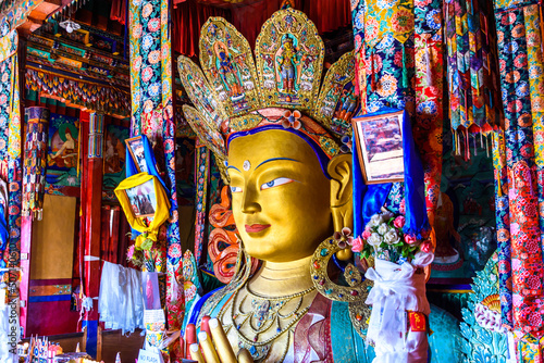 Beautiful and respectful golden buddha statue (Maitreya Buddha statue) in Thiksey monastery temple , Leh-Ladakh , India photo