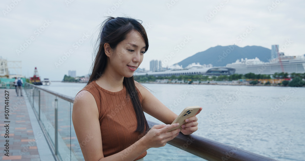Woman look at mobile phone at outdoor Woman look at mobile phone at outdoor