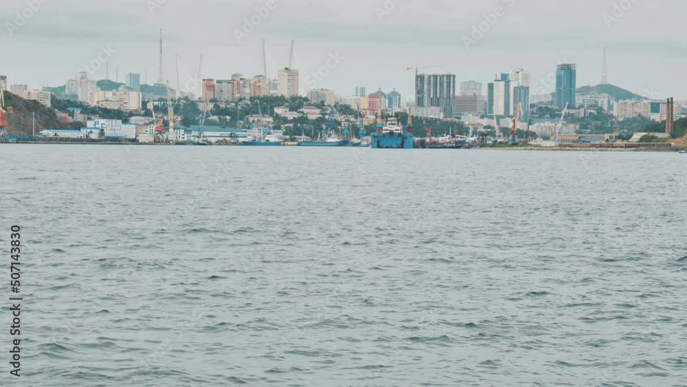 Panorama of the Russian city of Vladivstok. View from the moving ferry. Panorama of the Russian city of Vladivstok. View from the moving ferry.