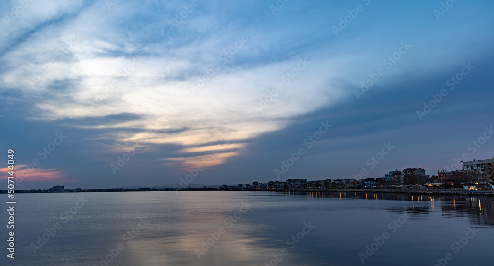 View of the reflection in the Black Sea against the background of the sky and sunset