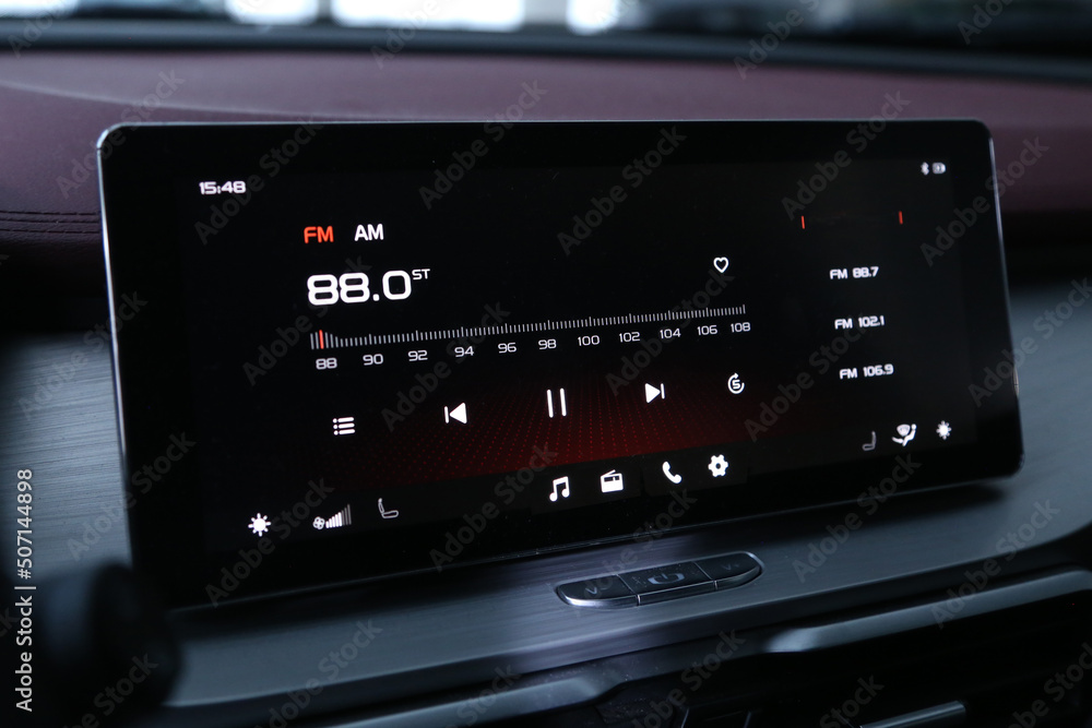 Car navigation system, close up. Monitor with audio stereo system, control panel and cd in modern luxury car. Car navigation system, close up. Monitor with audio stereo system, control panel and cd in modern luxury car.