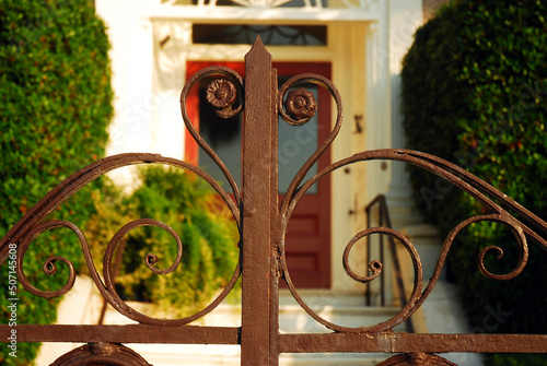 Canvas Print Details of a decorative wrought iron gate on a surrounding fence of an Antebellu