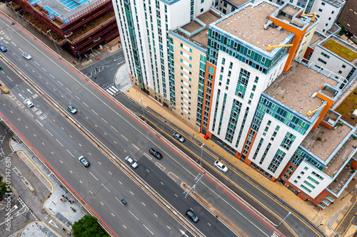 Aerial view of colourful apartment blocks and highway in a vibrant city
