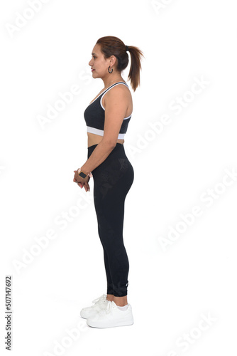 side view of a woman with sportswear and sneaker on white background
