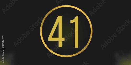 Number 41. Banner with the number forty one on a black background and gold details with a circle gold in the middle photo