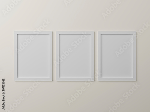 Vertical simple frame mockups. Three frame hanging on wall painted white color. Blank photo frame mockups for your design. 3d rendering illustration.