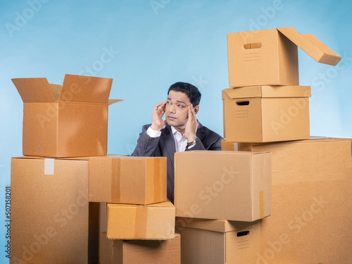 Businessman is holding head...