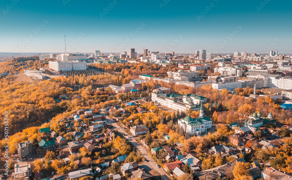 Aerial view of the central district and downtown of the city with administrative and government buildings at scenic golden autumn