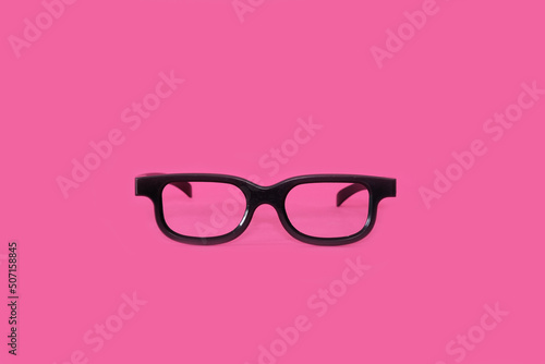 Glasses on a bright pink background