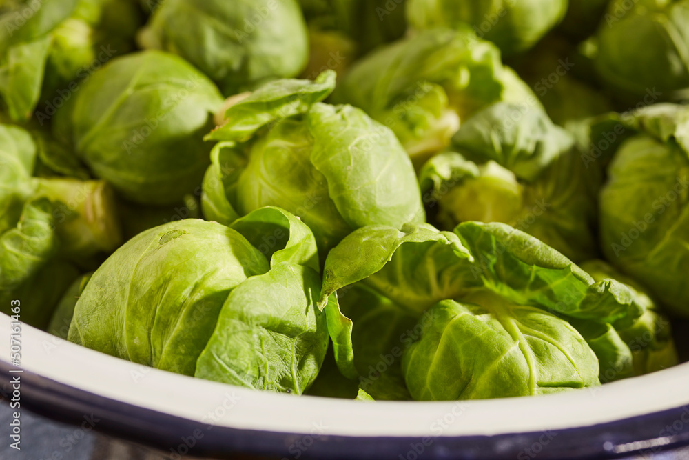 A bowl of raw, whole Brussels sprouts grown in Lancaster, Pennsylvania, USA A bowl of raw, whole Brussels sprouts grown in Lancaster, Pennsylvania, USA