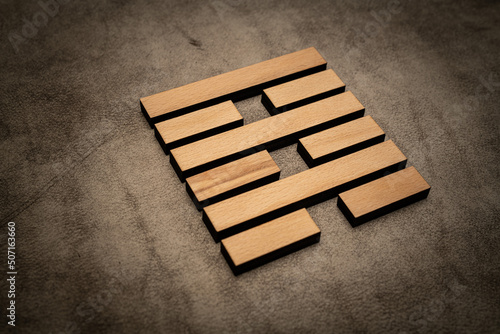 Gene Key 64 hexagram i ching wood on leather background human design