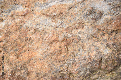 Background of a rocky surface in shades of brown and gray. Nature texture