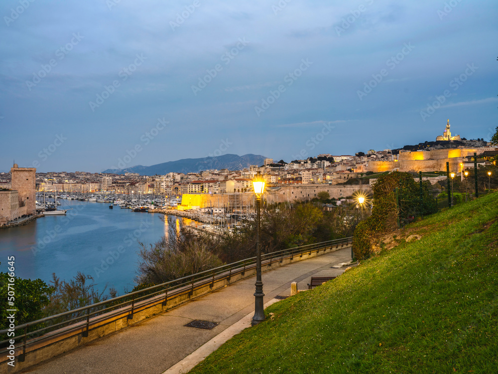 Fototapeta premium City of Marseille illuminated at dusk in the South of France