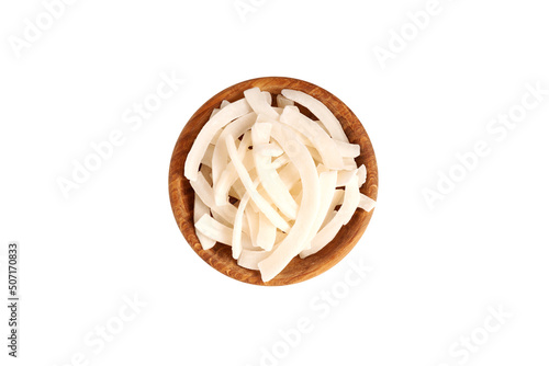 Dried coconut slices. Dehydrated, dried coconut chips in wooden bowl isolated on white background