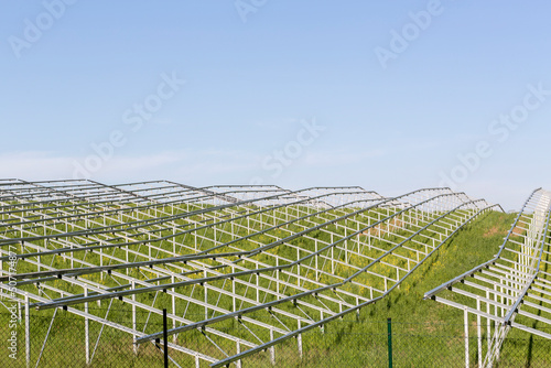 Renewable energy, large field of solar panels, framework of a large field of solar panels under construction