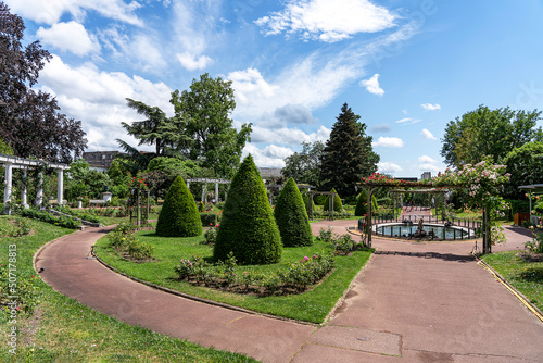 Shrubs trimmed in the form of cones and roses in Lecoq City Park in Clermont-Ferrand, France.