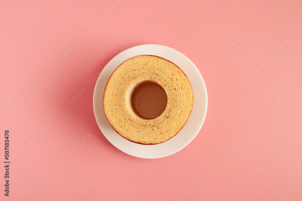 Eating Baumkuchen as a gift at a wedding ceremony at the table at tea time
 - obrazy, fototapety, plakaty 