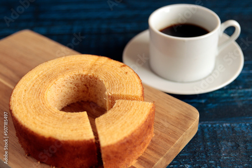 Eating Baumkuchen as a gift at a wedding ceremony at the table at tea time
 photo