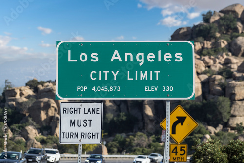 Los Angeles city limit sign on Topanga Canyon Blvd in Chatsworth, California.  Stoney Point park is in background.
