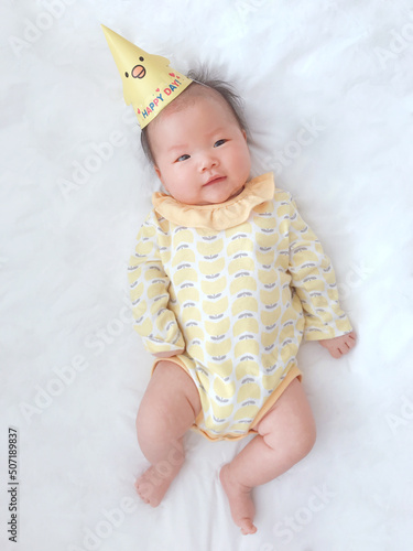 a 50-day-old baby, asian child lying on the blanket