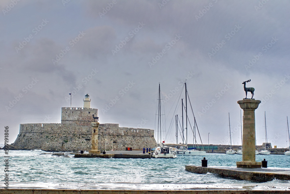 The Fort of Saint Nicholas at the mouth of the Mandraki harbour on the island of Rhodes, Greece