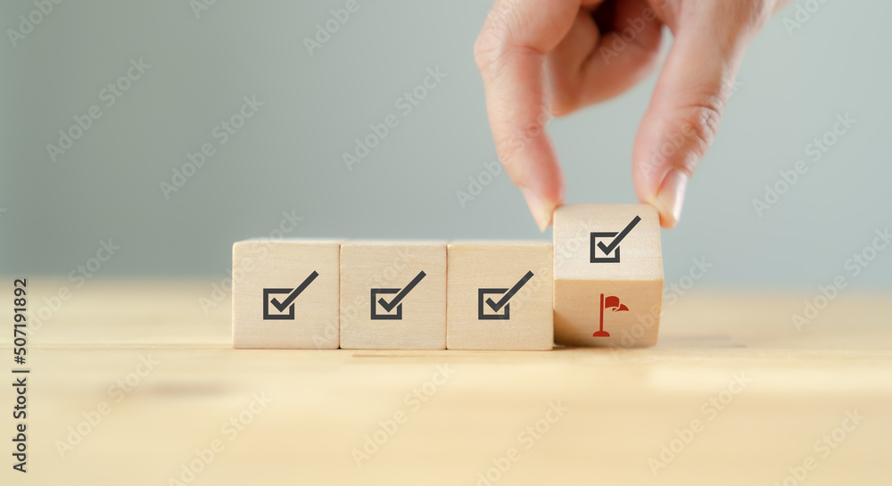 Corporate regulatory and compliance. Goals achievement and business success. Project and goals tracking. Task completion. Managing project timeline. Flipping wooden cube to target achievement icon. Corporate regulatory and compliance. Goals achievement and business success. Project and goals tracking. Task completion. Managing project timeline. Flipping wooden cube to target achievement icon.
