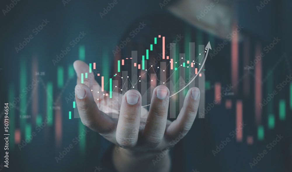 Businessman or trader showing stock virtual hologram growing, progress or success idea, digital marketing technology, stock market, economic growth graph, business planning and strategy. Businessman or trader showing stock virtual hologram growing, progress or success idea, digital marketing technology, stock market, economic growth graph, business planning and strategy.