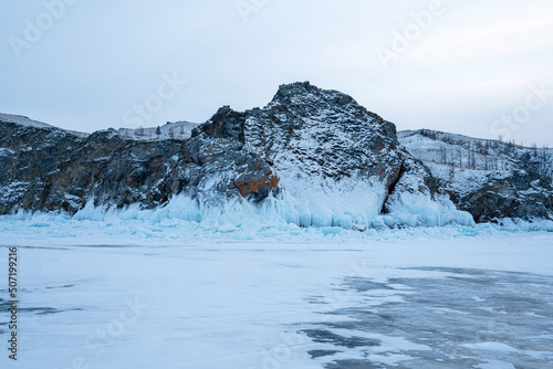 Lake Baikal in winter. Panorama of rocks near the island Olkhon from the ice