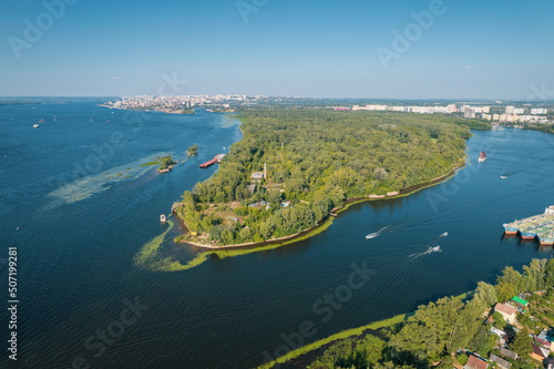 Fototapeta Naklejka Na Ścianę i Meble -  Aerial landscape view on Volga river with islands and green forest. Picturesque panoramic view from the height on the touristic part of the Volga river near Samara city at summer sunny day.