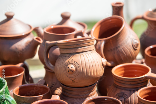 Pottery from earthenware jugs mugs in nature.