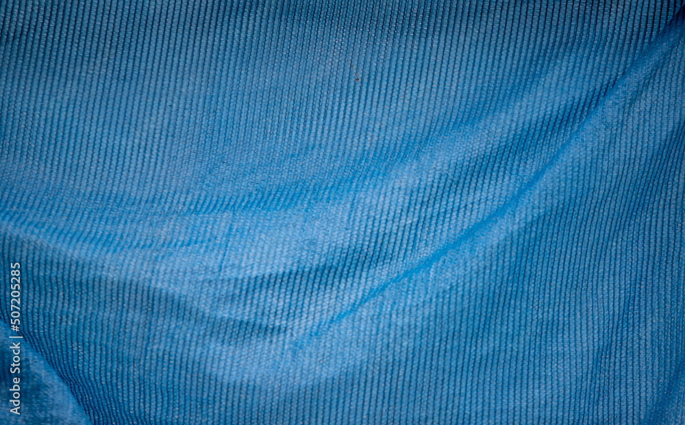 Blue fabric on the background of nature. Blue fabric on the background of nature.