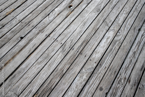 Old gray wooden fence, background texture.