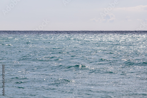 calm sea against the blue sky