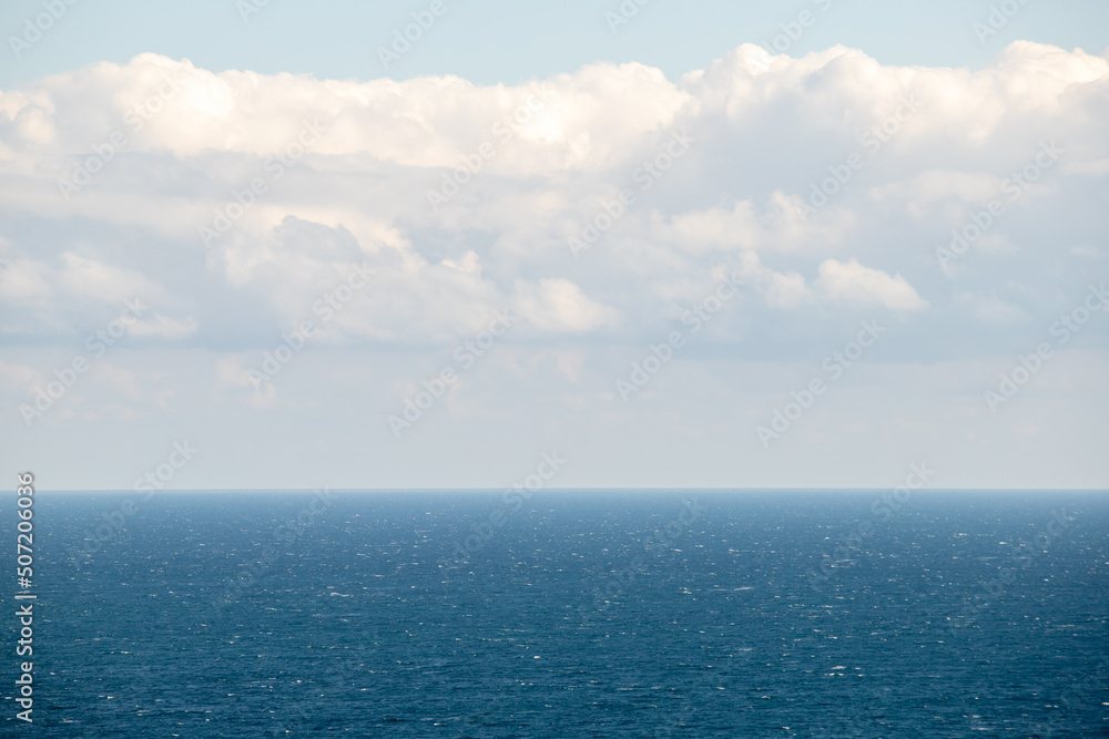 calm sea against the blue sky calm sea against the blue sky