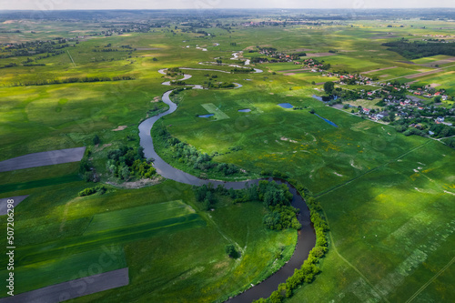 Wild Nida River in Poland Countryside at Spring. Aerial Drone View