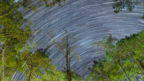 Beautiful winter scene in Timelapse 4K video with star trails. On top of a pine tree at a camping spot in Huai Nam Dang National Park, it is very beautiful. Chiang Mai Province, Thailand photo