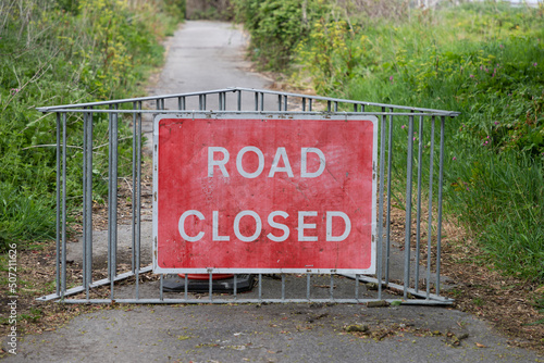 UK Road Closed Sign advising of a closed road due to coastal erosion in Happisburgh, North Norfolk in the UK photo