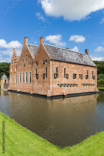 Historic Menkemaborg castle in the water in Uithuizen, Netherlands photo