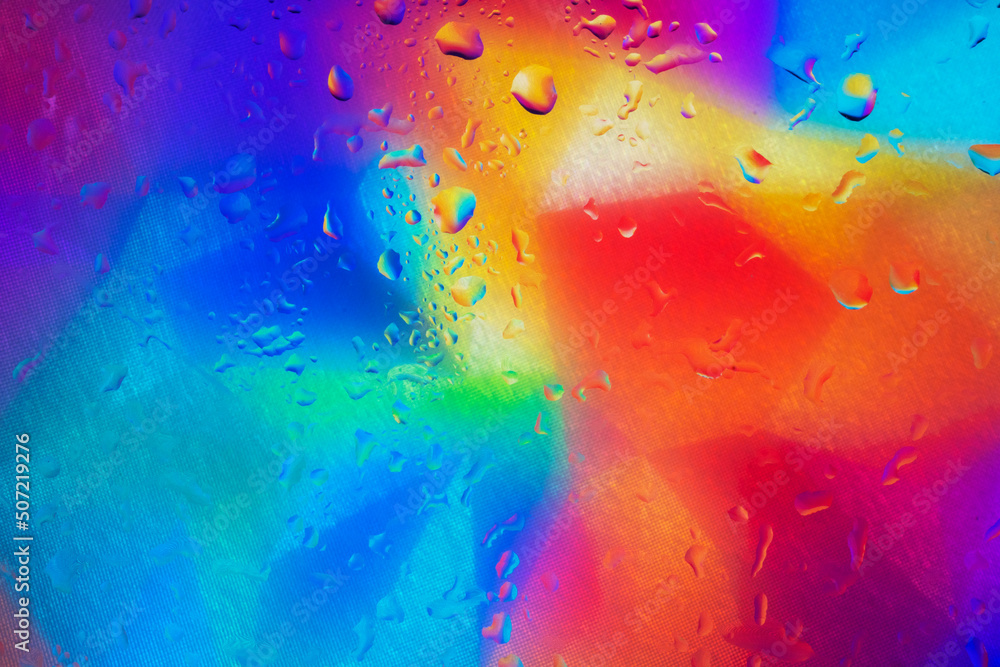 Colored background with rain effect on the window