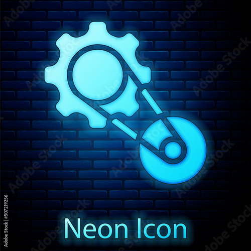 Glowing neon Timing belt kit icon isolated on brick wall background. Vector