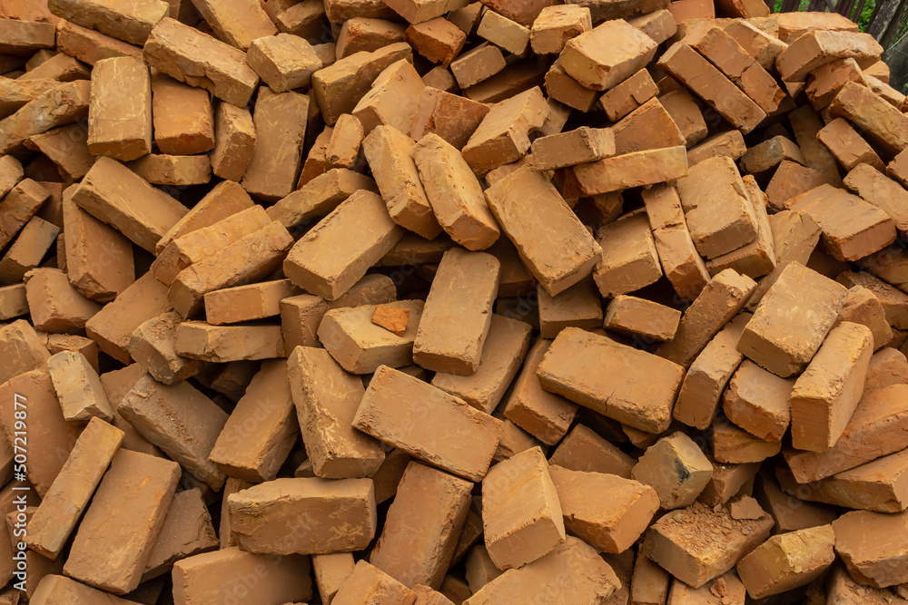 Solid clay brick used for construction. Background, brown red color Solid clay brick used for construction. Background, brown red color