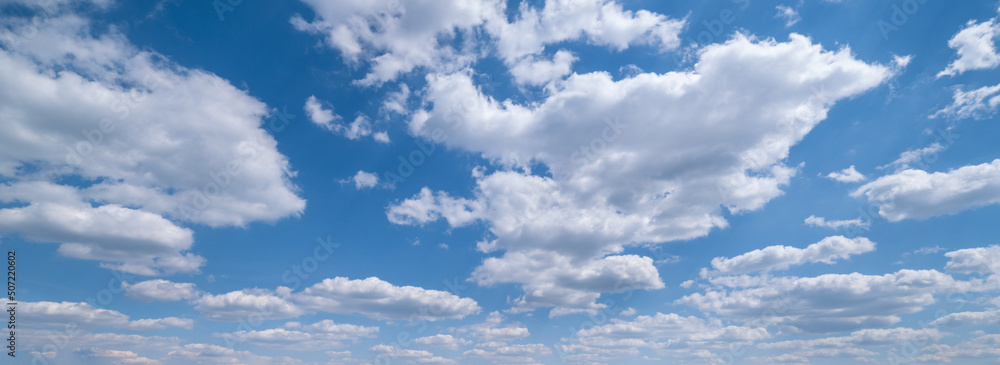 Fototapeta premium White clouds in blue summer sky panoramic background