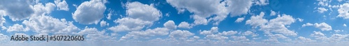 White clouds in blue summer sky panoramic background