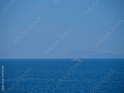 tourist boat traveling in the blue sea