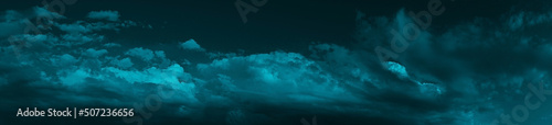 Night sky with clouds. Dark dramatic sky background with space for design. Web banner. Wide. Panoramic. Website header. Midnight. Moonlight. 