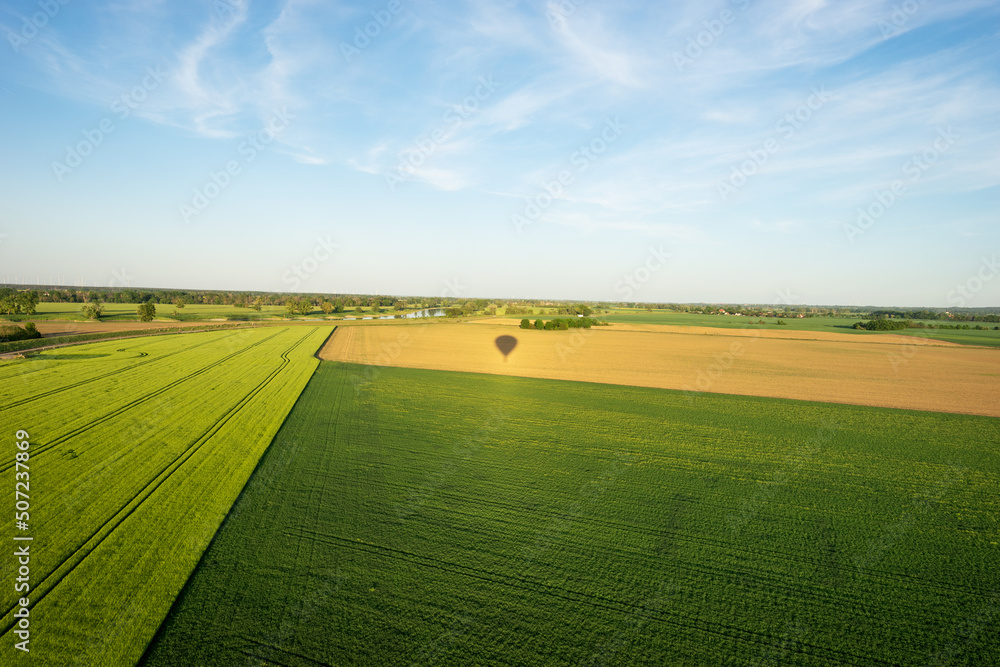 Hot air balloon shadow on the field