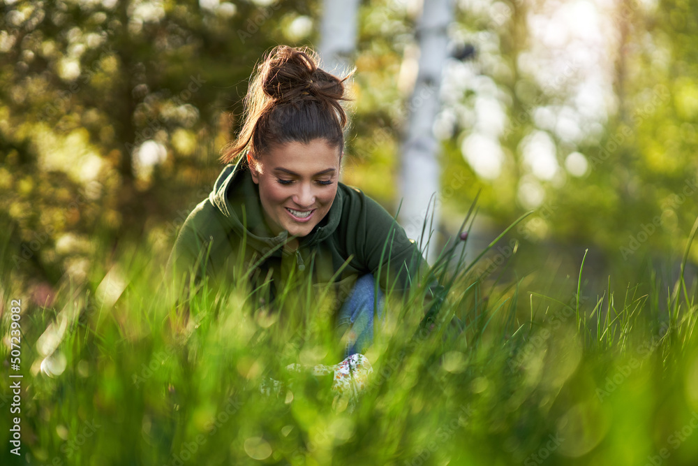 Young Happy woman with garden tools working Young Happy woman with garden tools working