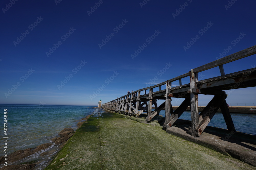 lighthouse sea and jetty