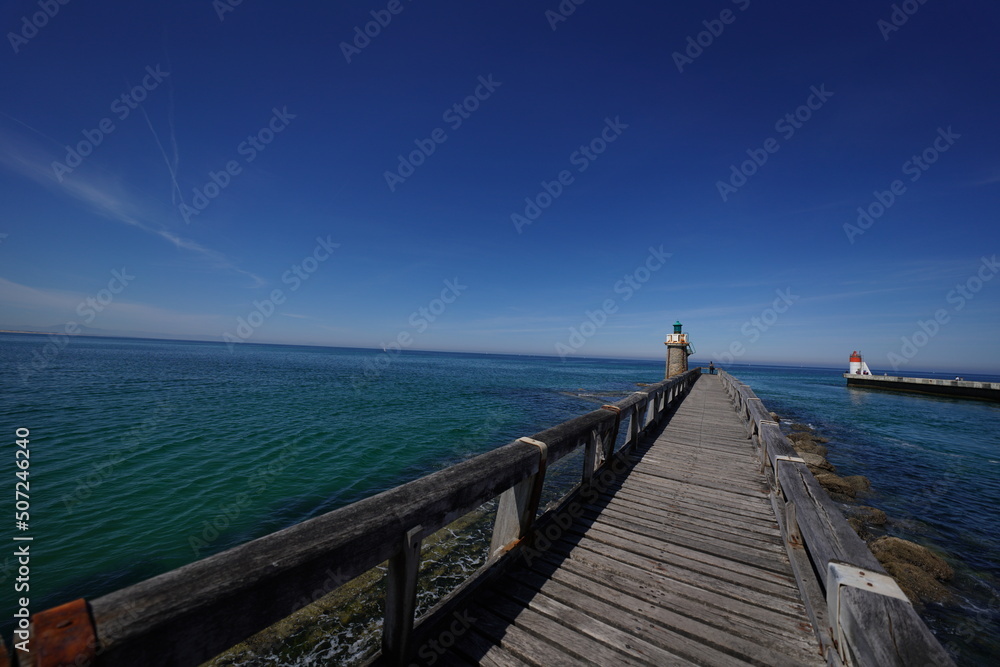 Fototapeta premium lighthouse sea and jetty